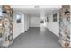 Carport with rock columns, gray flooring and street view at 1495 New Point Comfort Rd, Englewood, FL 34223
