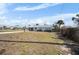 Charming single-story home boasting a light exterior paint and spacious front yard with well-maintained landscaping at 1495 New Point Comfort Rd, Englewood, FL 34223