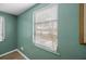 Window provides view of the water and trees at 1495 New Point Comfort Rd, Englewood, FL 34223