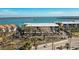 Aerial view of waterfront community with lush landscaping and parking at 1501 Beach Rd # 209, Englewood, FL 34223
