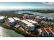 Aerial view of waterfront condo building with pool and parking at 1501 Beach Rd # 209, Englewood, FL 34223