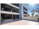 Spacious balcony overlooks palm trees and partial waterfront views at 1501 Beach Rd # 209, Englewood, FL 34223