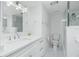 Modern bathroom with double vanity, quartz countertops, and a walk-in shower at 1501 Beach Rd # 209, Englewood, FL 34223