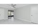 Bedroom with sliding doors leading to a private balcony at 1501 Beach Rd # 209, Englewood, FL 34223