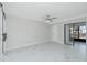 Spacious bedroom with ceiling fan and sliding doors to balcony at 1501 Beach Rd # 209, Englewood, FL 34223