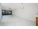 Spacious living room with marble flooring and sliding doors leading to a balcony at 1501 Beach Rd # 209, Englewood, FL 34223