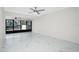 Bright living room with marble floors and sliding doors at 1501 Beach Rd # 209, Englewood, FL 34223