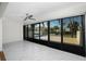 Bright living room with balcony access and marble floors at 1501 Beach Rd # 209, Englewood, FL 34223