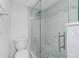 Large walk-in shower with marble tile and pebble floor at 1501 Beach Rd # 209, Englewood, FL 34223