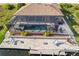 Aerial view of a home with a large pool and canal access at 15204 Aquarius Cir, Port Charlotte, FL 33981