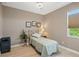 Small bedroom with twin bed, nightstand, and window at 15204 Aquarius Cir, Port Charlotte, FL 33981