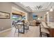Casual dining area with sliding doors to the pool and lanai at 15204 Aquarius Cir, Port Charlotte, FL 33981