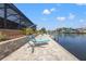 Enjoy this waterfront property with a relaxing dock and seating area at 15204 Aquarius Cir, Port Charlotte, FL 33981