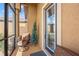 Enclosed porch with comfortable seating and small tree at 15204 Aquarius Cir, Port Charlotte, FL 33981