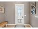 Inviting entryway with a modern door and neutral color scheme at 15204 Aquarius Cir, Port Charlotte, FL 33981