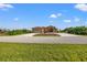 One-story home with a two-car garage and lush landscaping at 15204 Aquarius Cir, Port Charlotte, FL 33981