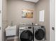 Laundry room with side-by-side washer and dryer at 15204 Aquarius Cir, Port Charlotte, FL 33981