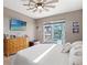 Spacious main bedroom with king bed, dresser, and access to backyard at 15204 Aquarius Cir, Port Charlotte, FL 33981