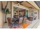 Outdoor patio with seating area, dining table, and view into the house at 15204 Aquarius Cir, Port Charlotte, FL 33981