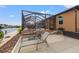 Spacious patio with lounge chairs and canal views at 15204 Aquarius Cir, Port Charlotte, FL 33981