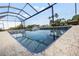 Relaxing spa with mosaic tile and screened enclosure at 15204 Aquarius Cir, Port Charlotte, FL 33981