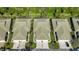 Aerial view of community with multiple villas and lush landscaping at 1577 Monarch Dr # 1577, Venice, FL 34293