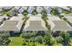 Overhead view showcases the neighborhood's neatly arranged homes and lush landscaping at 1577 Monarch Dr # 1577, Venice, FL 34293