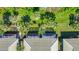 Aerial view showcasing villas with screened patios and a manicured lawn at 1577 Monarch Dr # 1577, Venice, FL 34293