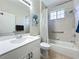 Bathroom with tub shower, single vanity, and neutral decor at 1577 Monarch Dr # 1577, Venice, FL 34293