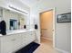 Double vanity bathroom with a walk-in shower and toilet at 1577 Monarch Dr # 1577, Venice, FL 34293