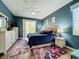 Spacious bedroom with ceiling fan and access to a private patio at 1577 Monarch Dr # 1577, Venice, FL 34293