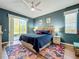 Bright bedroom with a king-size bed and plenty of natural light at 1577 Monarch Dr # 1577, Venice, FL 34293