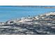 A cormorant perched on rocks near the ocean at 1577 Monarch Dr # 1577, Venice, FL 34293