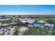 Community clubhouse with pool, fountain, and lush landscaping at 1577 Monarch Dr # 1577, Venice, FL 34293