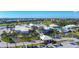 Resort-style clubhouse with pool, golf course views, and lush landscaping at 1577 Monarch Dr # 1577, Venice, FL 34293