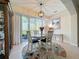 Bright dining room with round table, chairs, and garden view at 1577 Monarch Dr # 1577, Venice, FL 34293