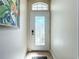 Bright entryway featuring a decorative glass door and neutral color scheme at 1577 Monarch Dr # 1577, Venice, FL 34293