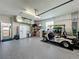 Spacious garage with golf cart and ample storage at 1577 Monarch Dr # 1577, Venice, FL 34293