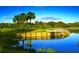 Scenic golf course with water features and palm trees at 1577 Monarch Dr # 1577, Venice, FL 34293
