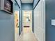 Clean hallway with mirrored closet doors and access to the bathroom at 1577 Monarch Dr # 1577, Venice, FL 34293