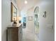 Elegant hallway with decorative console table and mirror at 1577 Monarch Dr # 1577, Venice, FL 34293