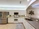 Modern kitchen with stainless steel appliances and white cabinetry at 1577 Monarch Dr # 1577, Venice, FL 34293