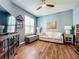 Bright office with hardwood floors, and a comfortable couch at 1577 Monarch Dr # 1577, Venice, FL 34293