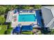 Community pool with ample deck space and lounge chairs at 1577 Monarch Dr # 1577, Venice, FL 34293