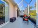 Enjoy this relaxing screened porch with comfortable seating at 1577 Monarch Dr # 1577, Venice, FL 34293