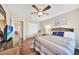 Bright bedroom with a queen-size bed and dresser at 18198 Burkholder Cir, Port Charlotte, FL 33948
