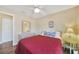 Bedroom with full bed, dresser, and ceiling fan at 18198 Burkholder Cir, Port Charlotte, FL 33948