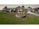 Charming single-story home with well-manicured lawn and inviting entryway at 18198 Burkholder Cir, Port Charlotte, FL 33948