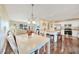 Modern kitchen with white cabinets, stainless steel appliances, and breakfast bar at 18198 Burkholder Cir, Port Charlotte, FL 33948