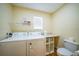 Convenient laundry room with washer, dryer, and extra storage at 18198 Burkholder Cir, Port Charlotte, FL 33948